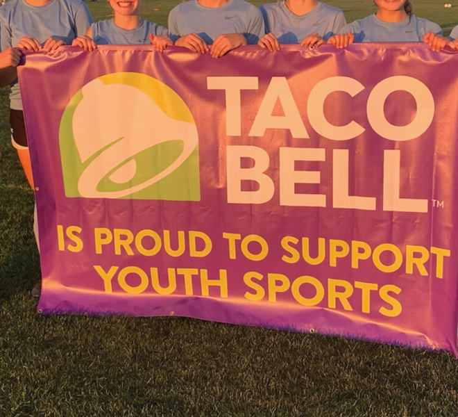 sports team holding taco bell banner